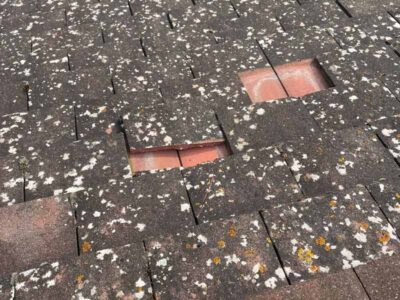 Storm damaged tiles cracked and missing tiles on roof. Property in the Southwest