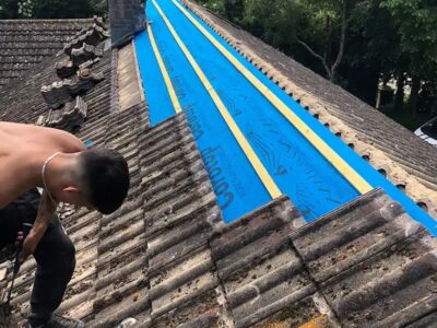 Roof ridge and verges removed for new felt and battens the Southwest